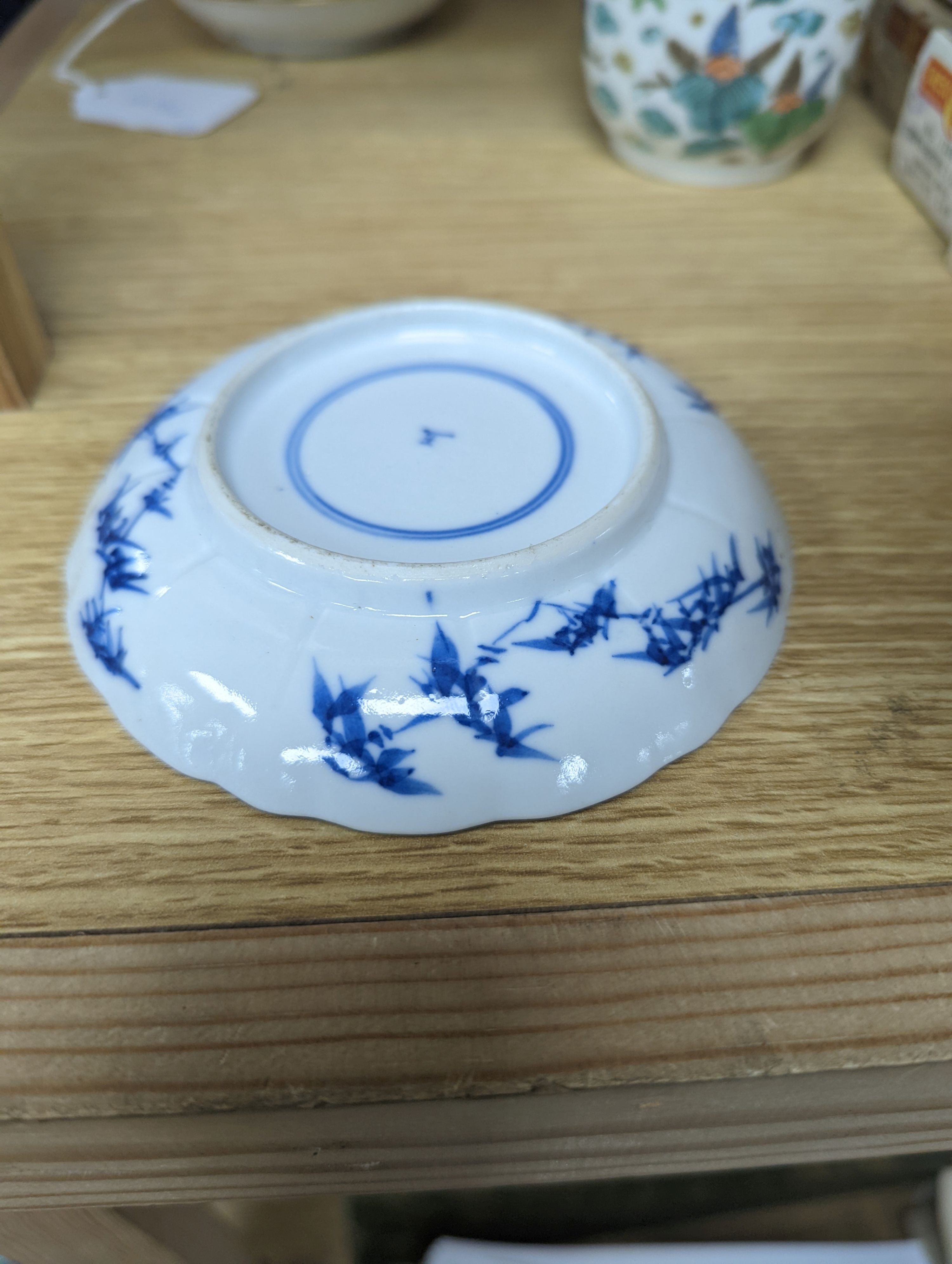 Two Chinese porcelain saucer dishes and an enamelled porcelain vase, 18th century and later, 12.5cm